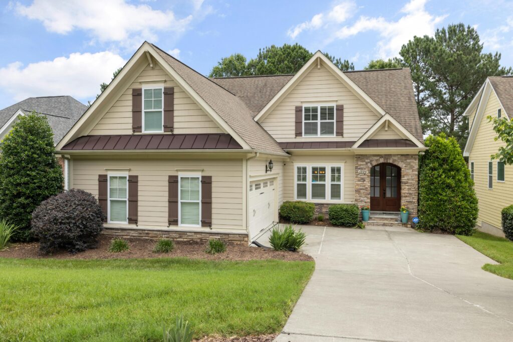 Beautiful suburban house with manicured lawn and modern architecture on a sunny day.